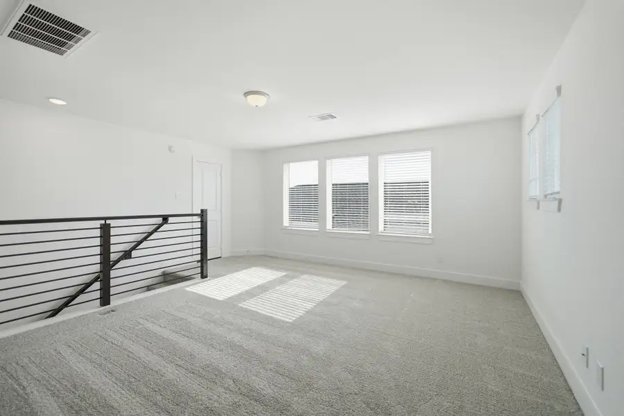 Spacious, unfurnished interior of a new home in Sunterra Lakes, Brookshire (Image 32).