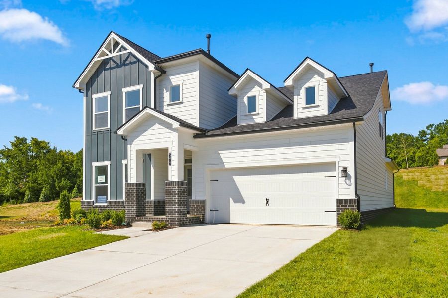 Front exterior of a new home in Hidden Springs - The Village Collection, Smyrna, TN, highlighting curb appeal (Image 24). Front exterior of a new home in Hidden Springs - The Village Collection, Smyrna, TN, highlighting curb appeal (Image 24).