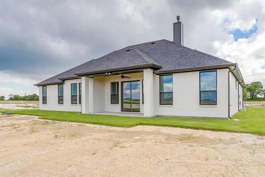 Exterior details and patio area of a home in Peaks at Lone Elm, Waxahachie (Image 4).