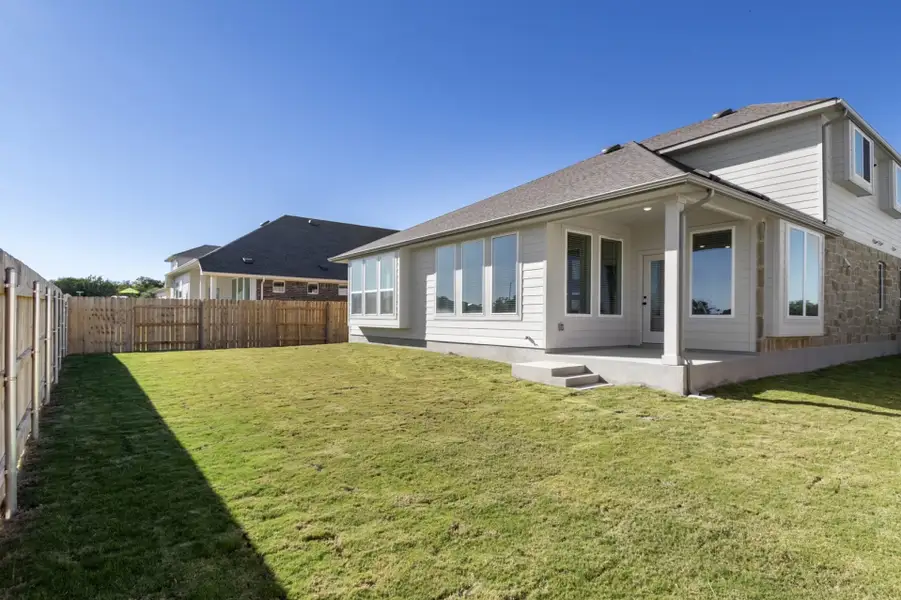 Exterior details and patio area of a home in Grande Estates, Bertram (Image 3).
