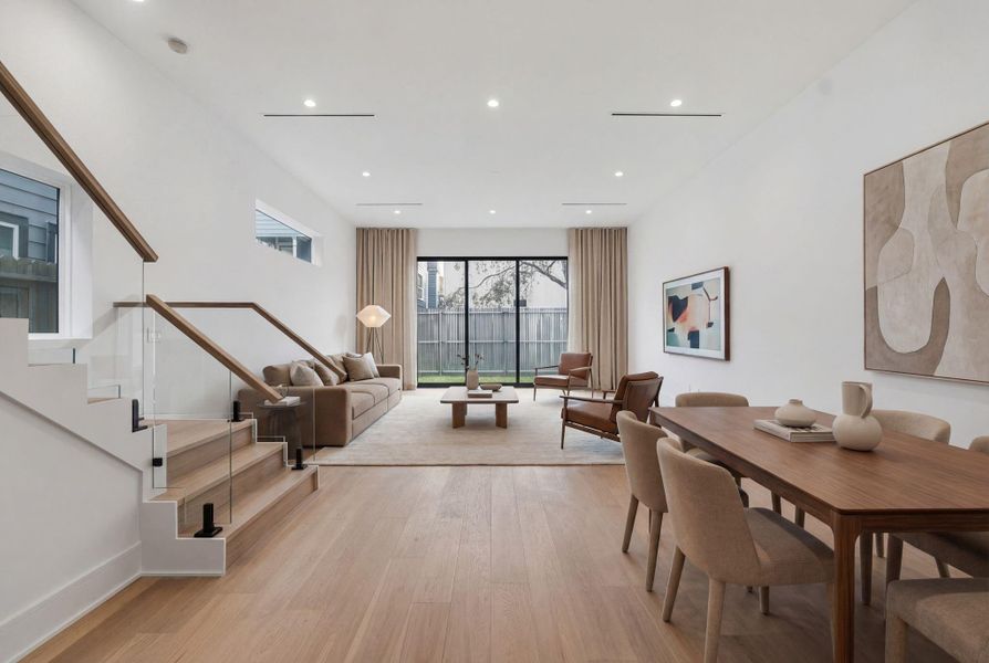 Kitchen opens to beautiful, light-filled dining and family room. *virtually staged