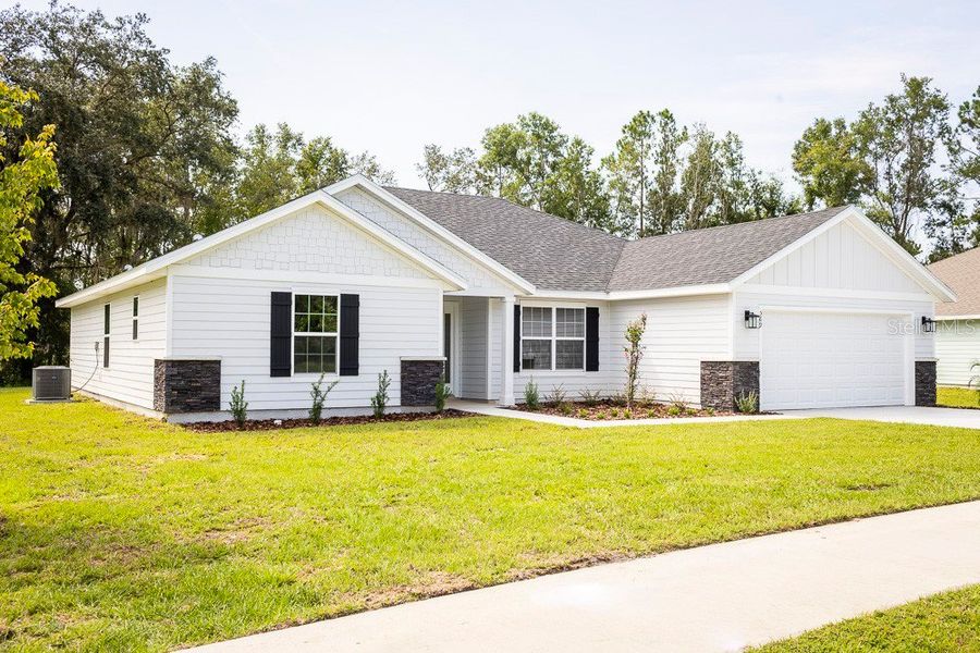 Front exterior of a new home in The Preserve at Laurel Lake, Lake City, FL, highlighting curb appeal (Image 2). Front exterior of a new home in The Preserve at Laurel Lake, Lake City, FL, highlighting curb appeal (Image 2).
