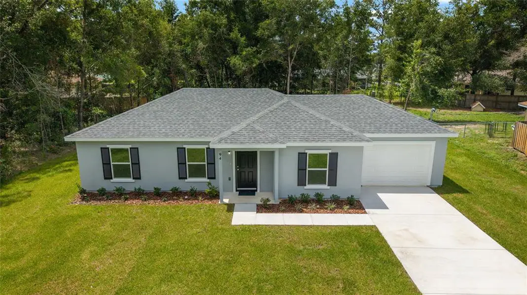 Front exterior of a new home in , Ocala, FL, highlighting curb appeal (Image 2).