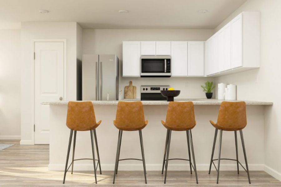 A kitchen with a table and chairs. A kitchen with a table and chairs.