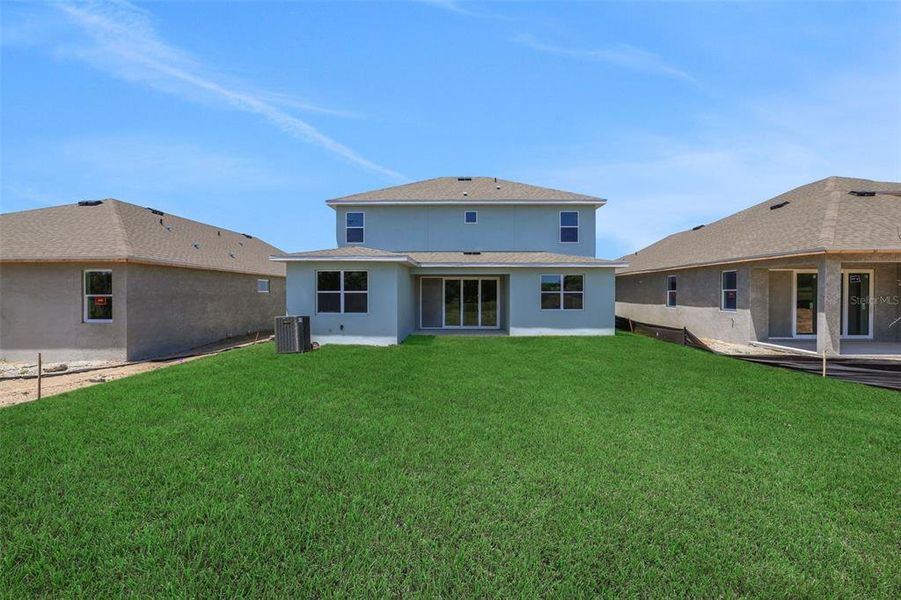 Exterior details and patio area of a home in Serenade at Ovation, Winter Garden (Image 19). Exterior details and patio area of a home in Serenade at Ovation, Winter Garden (Image 19).