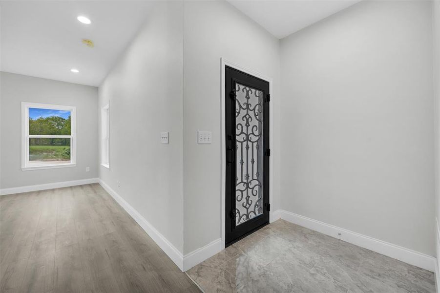 Foyer with baseboards and recessed lighting Foyer with baseboards and recessed lighting