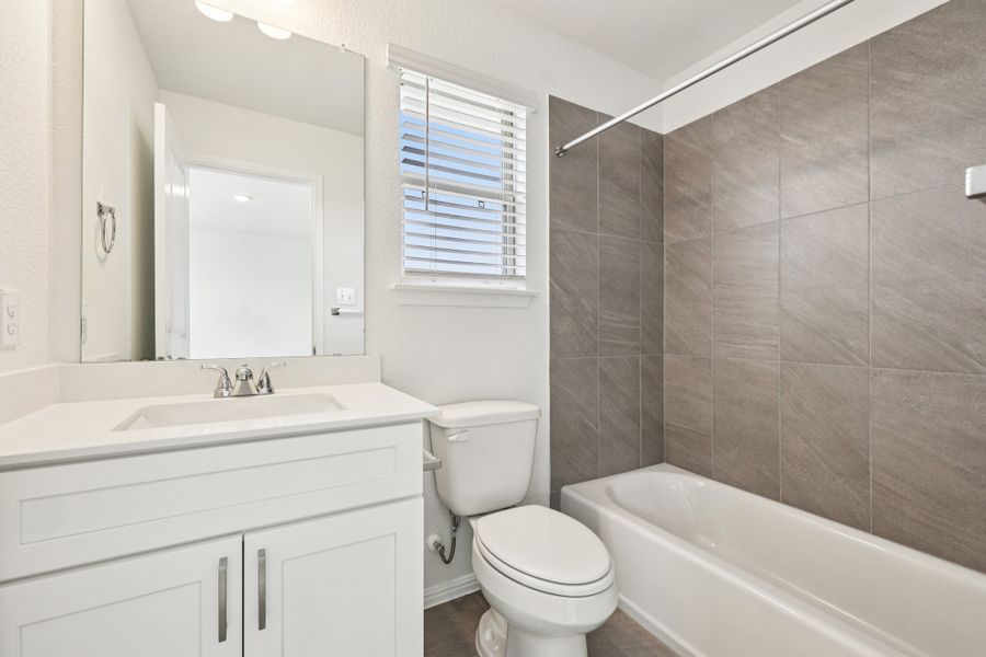 Furnished interior view inside a new home in Crosswinds, Kyle (Image 12).