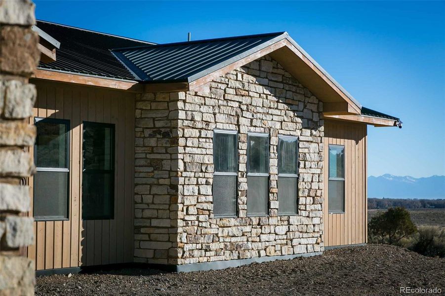Exterior is stone and wood siding.