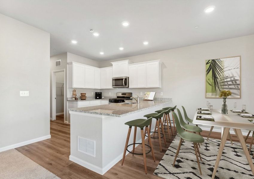 The kitchen has stainless steel appliances and plank flooring The kitchen has stainless steel appliances and plank flooring