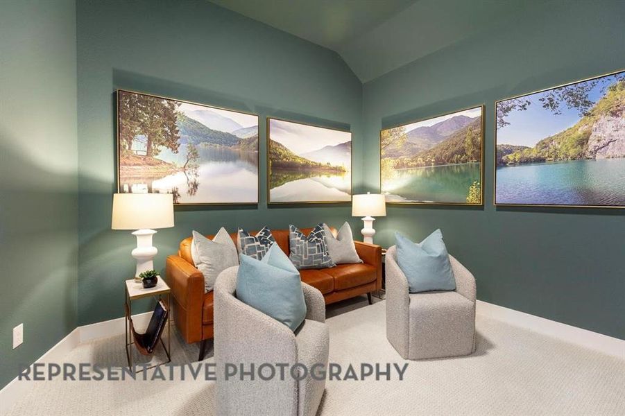 Living area with lofted ceiling and a water view