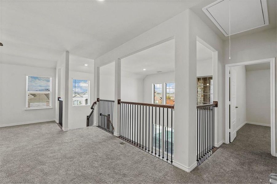 Hallway featuring carpet flooring