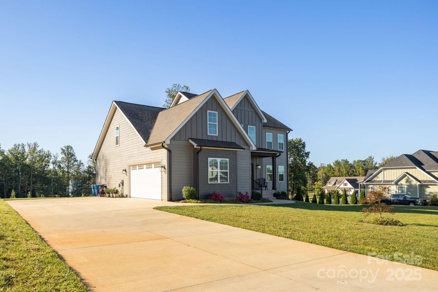 Front exterior of a new home in , Mocksville, NC, highlighting curb appeal (Image 25).