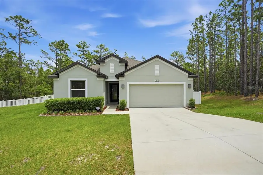 Front exterior of a new home in , Homosassa, FL, highlighting curb appeal (Image 28).