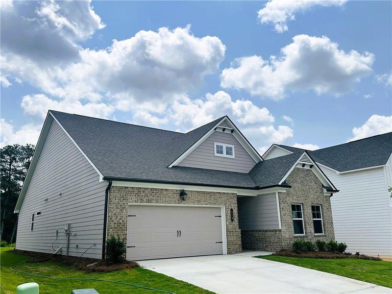Front exterior of a new home in Summerlin, Winder, GA, highlighting curb appeal (Image 21).