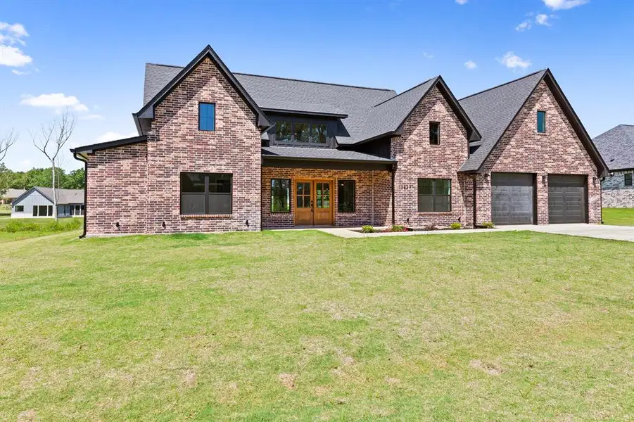 Front exterior of a new home in , Tyler, TX, highlighting curb appeal (Image 1). Front exterior of a new home in , Tyler, TX, highlighting curb appeal (Image 1).