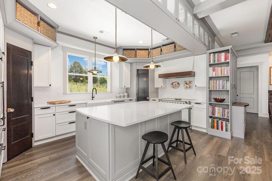 Classic kitchen with large center island, bookshelves for all of your cookbooks Classic kitchen with large center island, bookshelves for all of your cookbooks