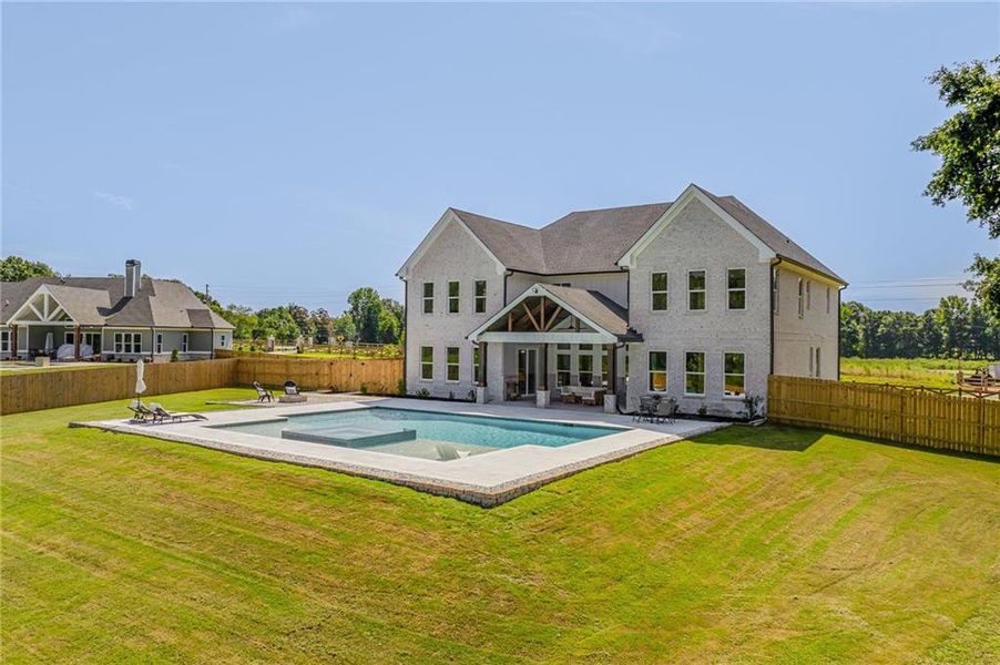 Front exterior of a new home in , Dacula, GA, highlighting curb appeal (Image 23).