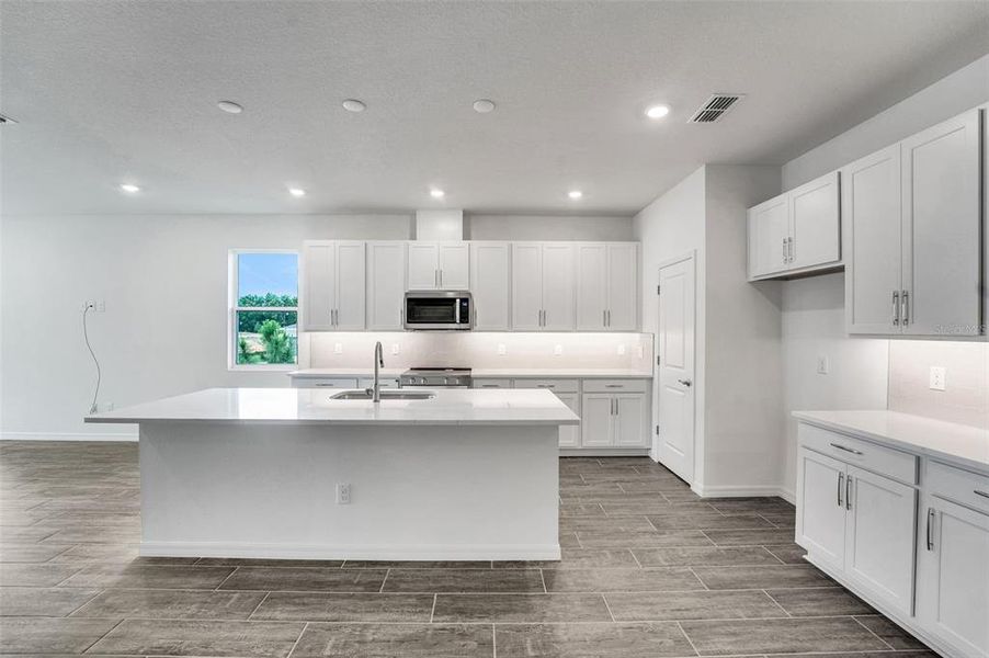 Furnished interior view inside a new home in Tuscan Hills, Dade City (Image 7).