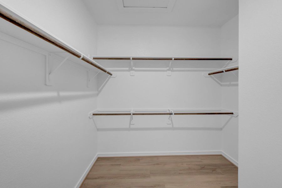 Walk-in closet in the primary suite (*Photo not of actual home and used for illustration purposes only.) Walk-in closet in the primary suite (*Photo not of actual home and used for illustration purposes only.)