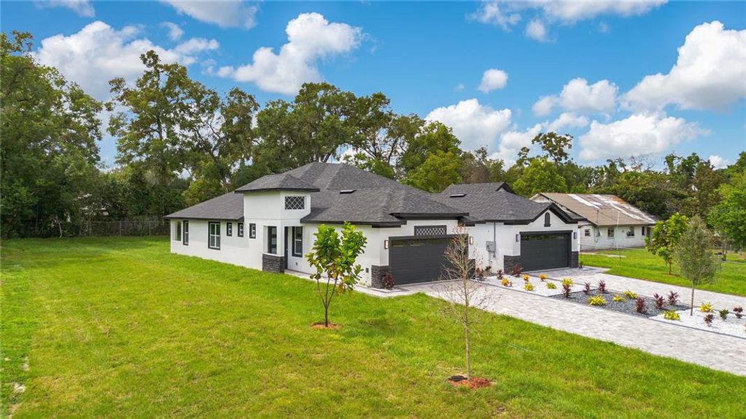 Front exterior of a new home in , Apopka, FL, highlighting curb appeal (Image 25).
