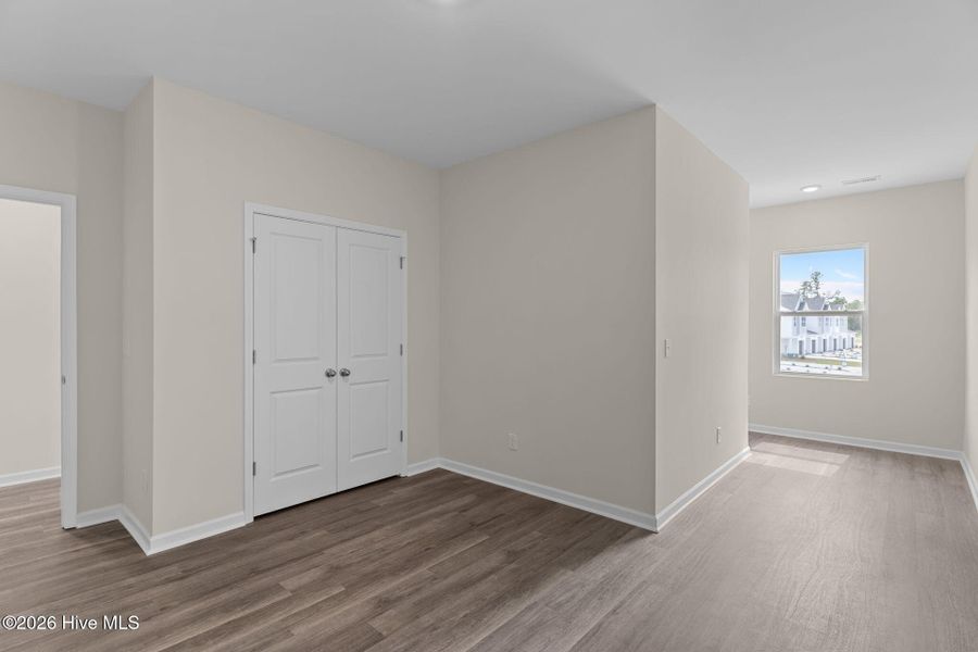 Spacious, unfurnished interior of a new home in Coastal Haven Townes, Leland (Image 12).