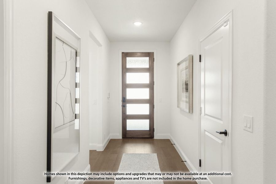 Entryway hallway with wood and glass front door, white walls, and hardwood floors Entryway hallway with wood and glass front door, white walls, and hardwood floors