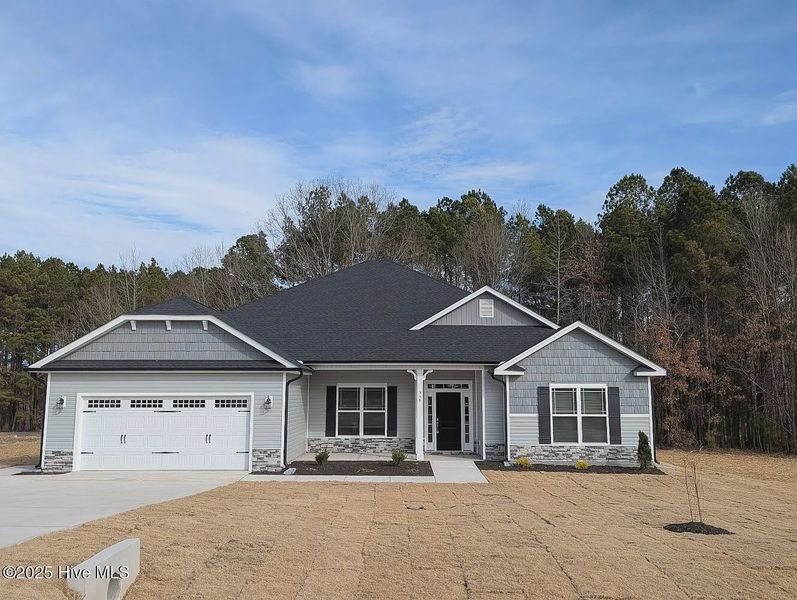 Front exterior of a new home in Harvest Creek, Nashville, NC, highlighting curb appeal (Image 1).