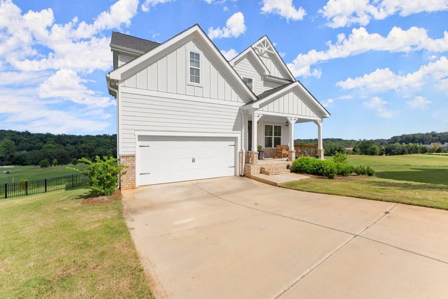 Front exterior of a new home in , Homer, GA, highlighting curb appeal (Image 20).