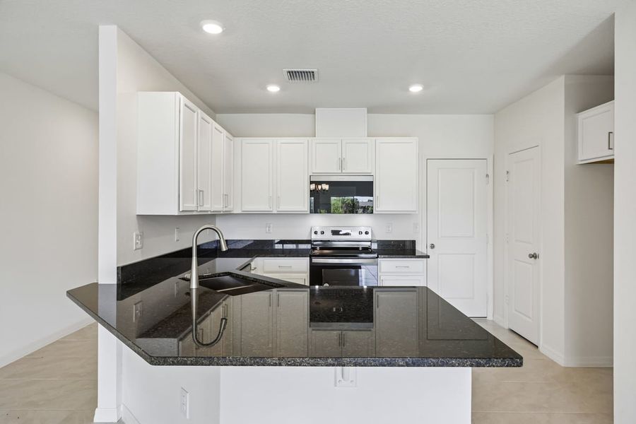 Furnished interior view inside a new home in Reserve at Forest Lake Townhomes, Lake Wales (Image 6).