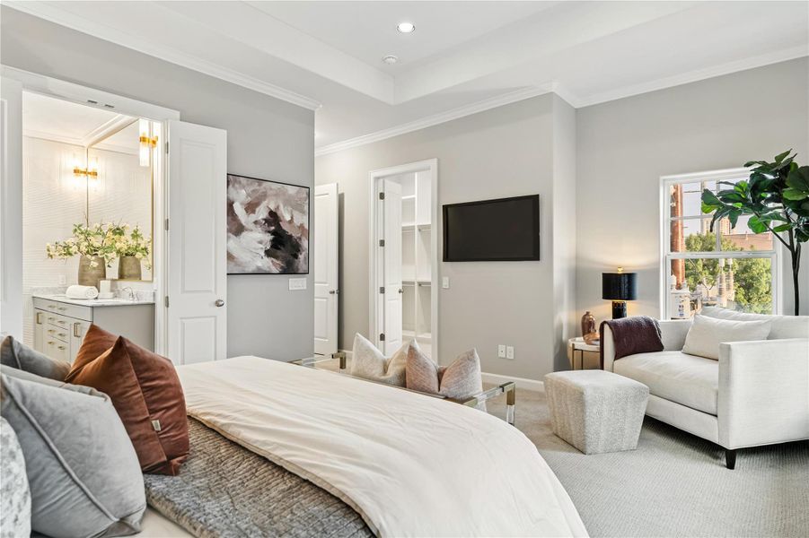 Primary suite offers high ceilings and a sense of tranquility.