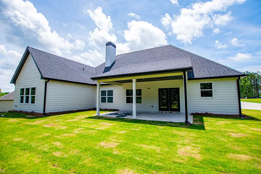 Exterior details and patio area of a home in WOODMONT RESERVE, Roopville (Image 48).