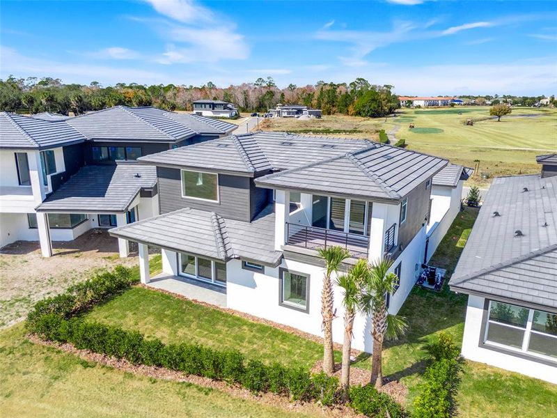 Exterior details and patio area of a home in Hampton Green at Providence, Davenport (Image 37).