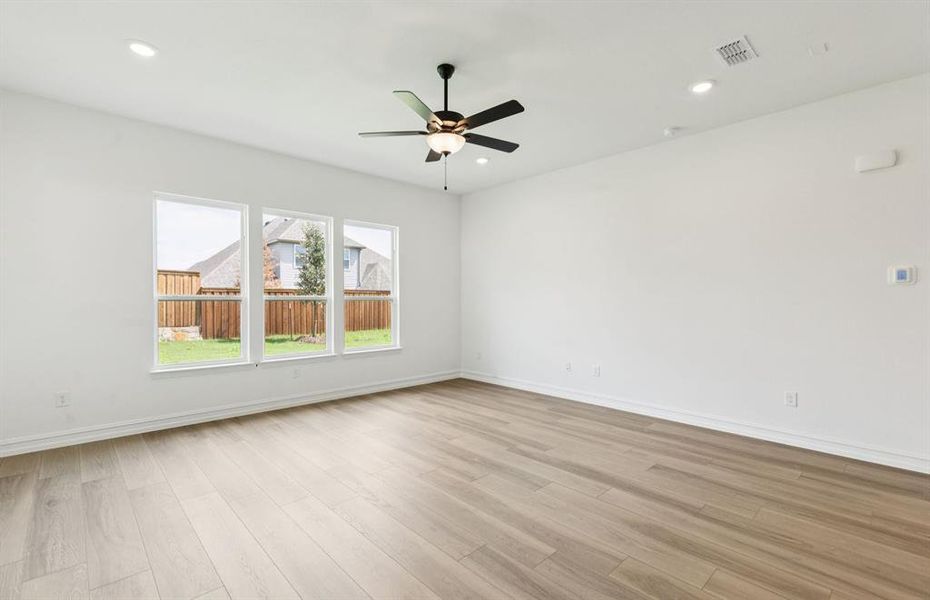 Sunlit gathering room designed for relaxation and entertainment Sunlit gathering room designed for relaxation and entertainment