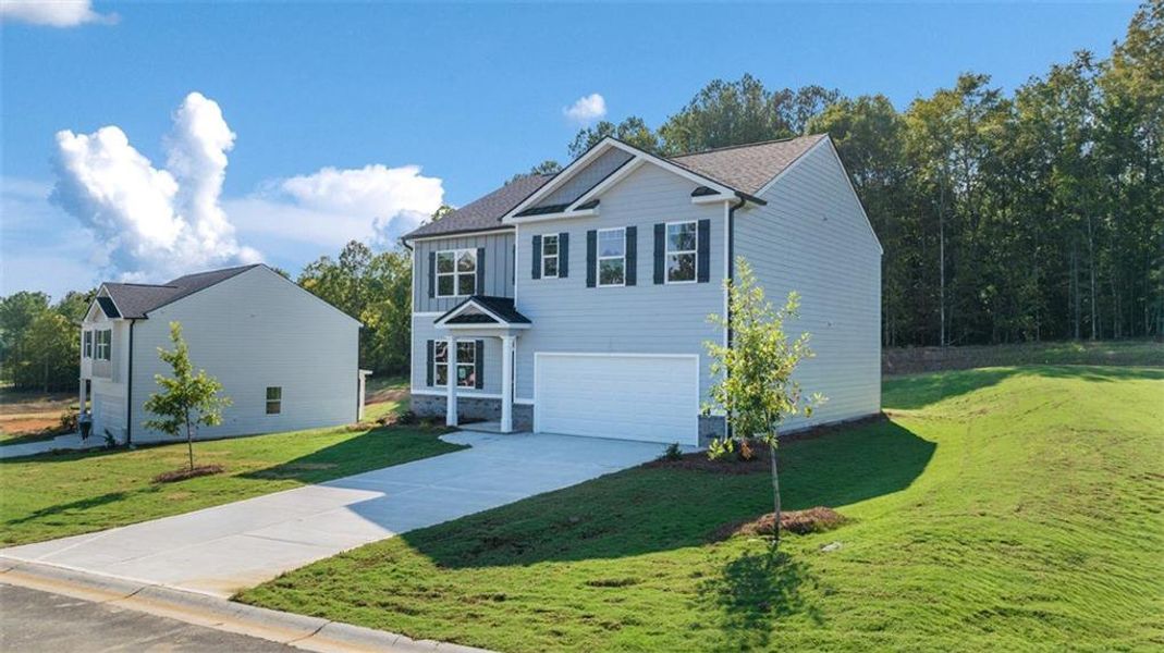 Front exterior of a new home in Kingston Ranch at Lake Oconee, Buckhead, GA, highlighting curb appeal (Image 28). Front exterior of a new home in Kingston Ranch at Lake Oconee, Buckhead, GA, highlighting curb appeal (Image 28).
