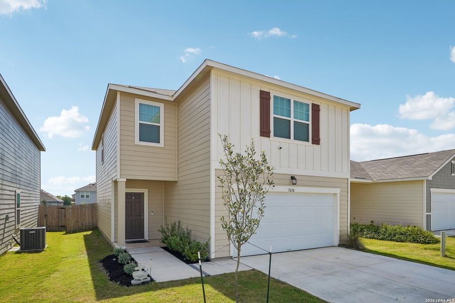 Front exterior of a new home in Hennersby Hollow, San Antonio, TX, highlighting curb appeal (Image 23).