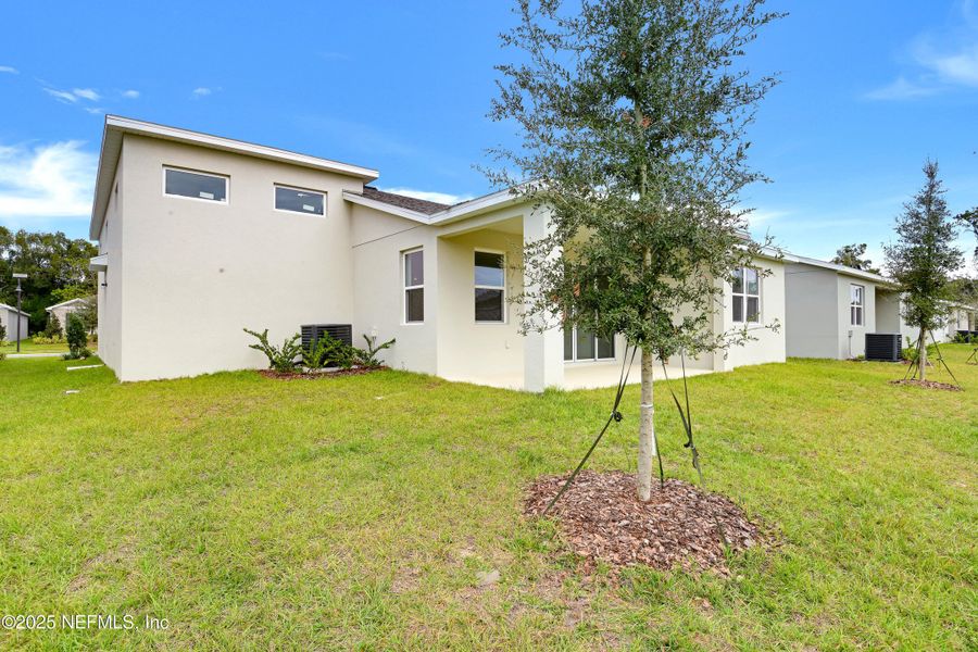 Exterior details and patio area of a home in Seasons at Grandview Gardens, Deland (Image 4).