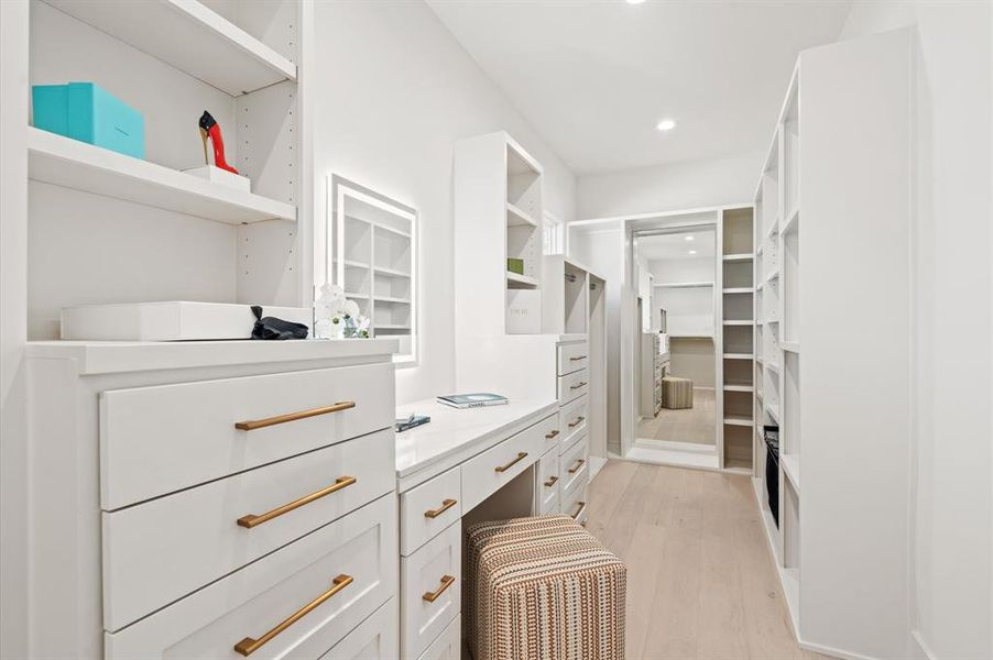 "Hers" walk in closet with makeup vanity. Previous TOMO Homes project.