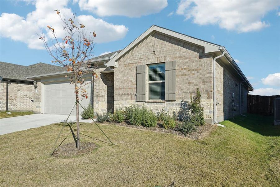 Front exterior of a new home in Windmore, Princeton, TX, highlighting curb appeal (Image 23).