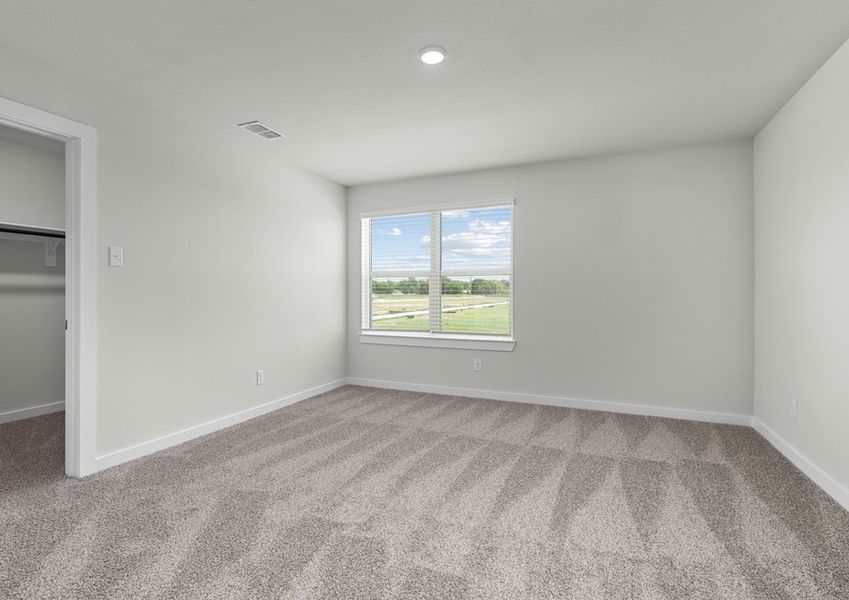 Spacious master suite with large window. Spacious master suite with large window.
