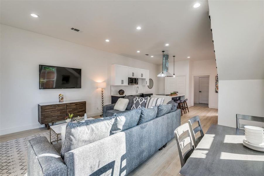 Living room with light hardwood / wood-style floors