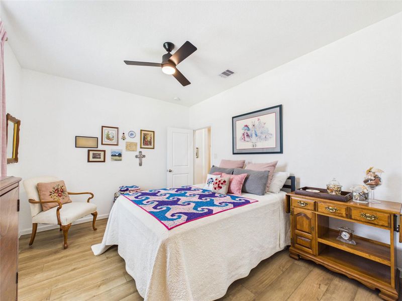 This 3rd bedroom also has LVP flooring, a ceiling fan and walk-in closet.