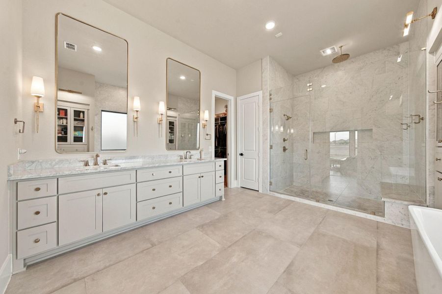 This primary bath was built for everyday function, offering his-and-hers sink space.