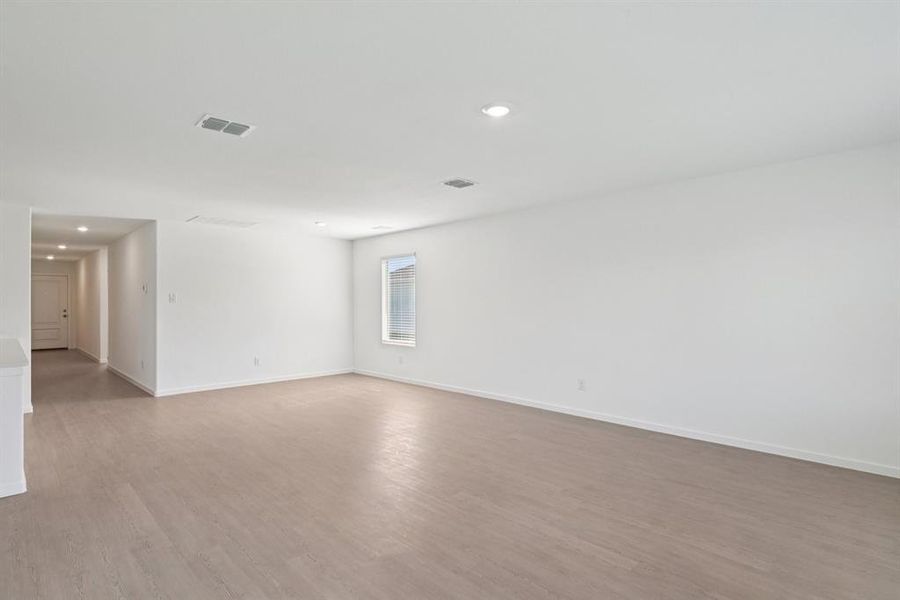 Spare room with light wood-style floors and recessed lighting Spare room with light wood-style floors and recessed lighting