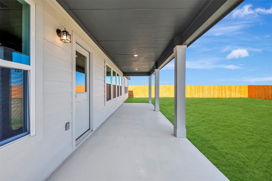 Exterior details and patio area of a home in Carillon, Manor (Image 18).