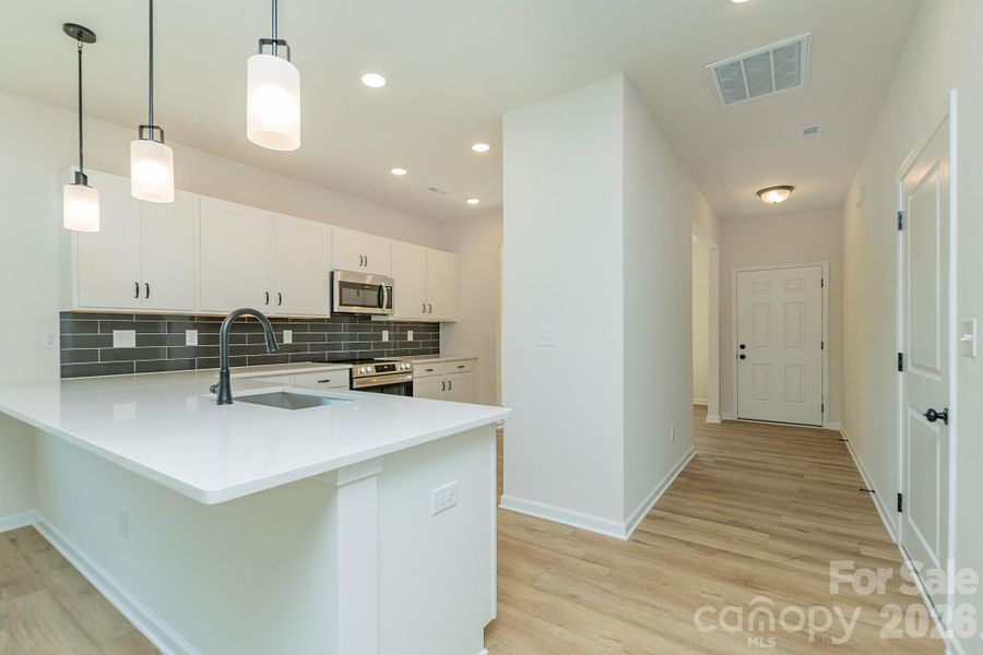 Furnished interior view inside a new home in Country Club Village, Salisbury (Image 8).