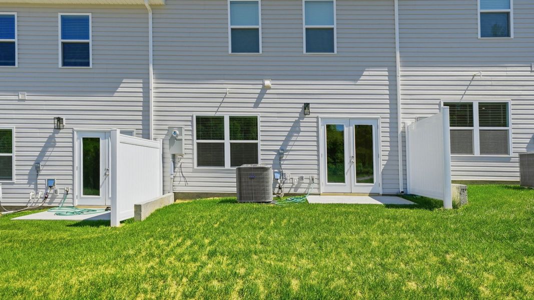 Exterior details and patio area of a home in The Arbor Townhomes, Kingsport (Image 3).