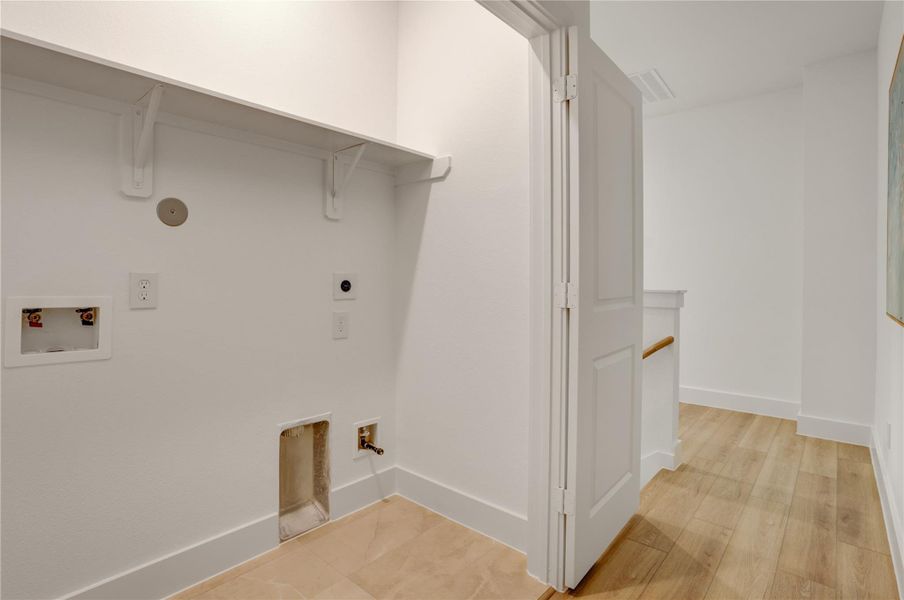 The 3x6 SF utility room has tile floor and built in shelf.