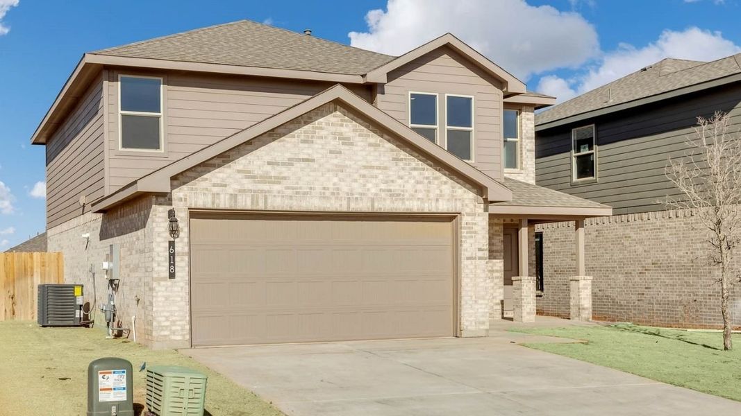 Front exterior of a new home in Overlook West, Wolfforth, TX, highlighting curb appeal (Image 15).
