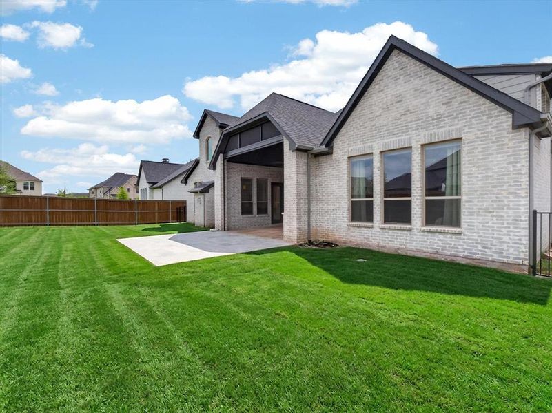 Exterior details and patio area of a home in Light Farms Graham/Reagan, Celina (Image 21). Exterior details and patio area of a home in Light Farms Graham/Reagan, Celina (Image 21).
