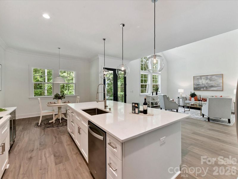 Kitchen also features subway tile backsplash, pot filler, and a spacious island designed for both cooking and entertaining.